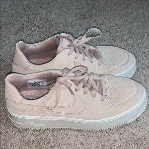 Blush Nike Air Force platform sneakers